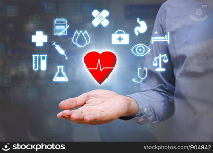 Close up of hand man show holding heart in palm ,Healthcare concept.