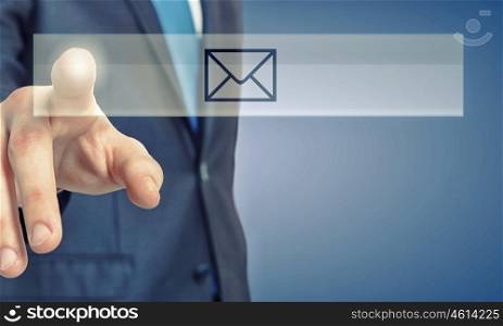 Close up of hand pressing e-mail sign with finger. Mail icon