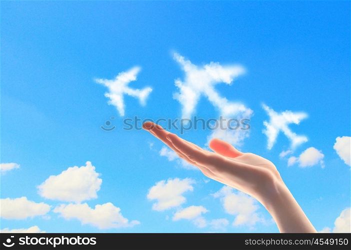Close up of hand with airplanes symbols. Close up image of hand with airplanes symbols