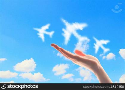 Close up of hand with airplanes symbols. Close up image of hand with airplanes symbols