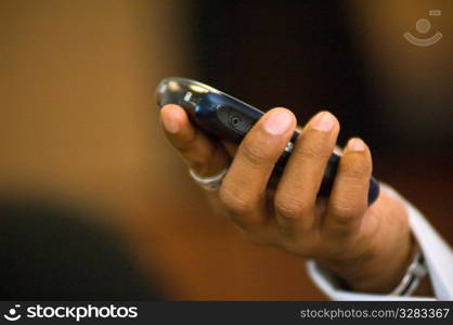 Close-up of hand with cellular PDA.