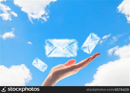 Close up of hand with envelope symbols. Close up of hand with envelope symbols. E-mail concept
