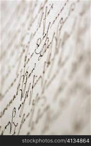 Close-up of hand written text on paper