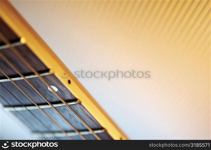 Close-up of handle and strings of electric guitar