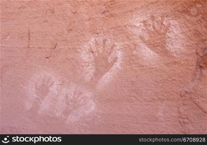 Close-up of handprints on a rocky surface