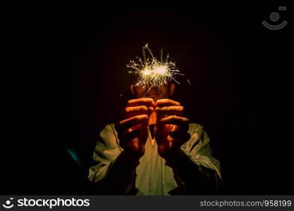 Close up of Hands Holding Sparklers At Night, Firework celebrate at night