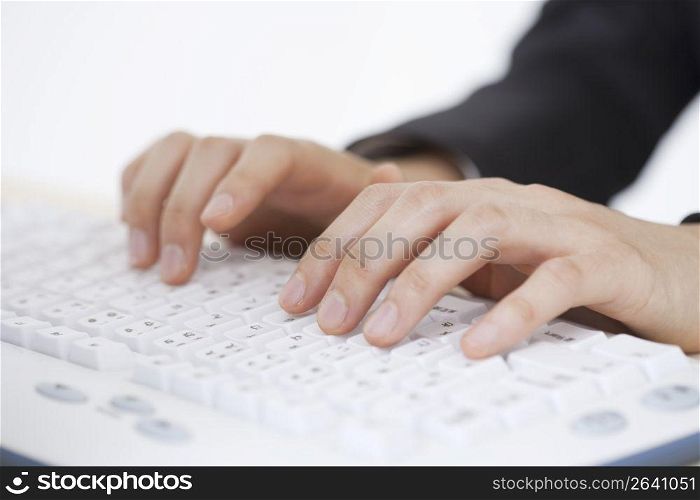 Close up of hands on computer keyboard