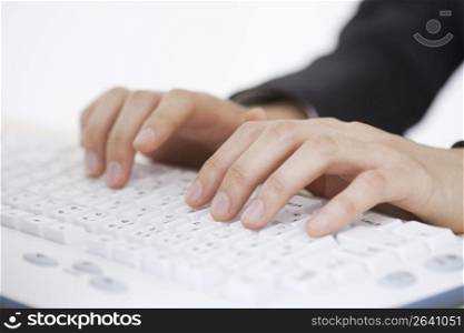 Close up of hands on computer keyboard