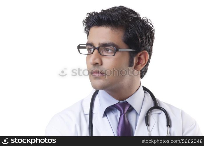 Close-up of handsome doctor over white background