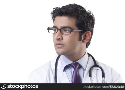 Close-up of handsome doctor over white background