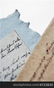 Close-up of handwritten text on handmade paper