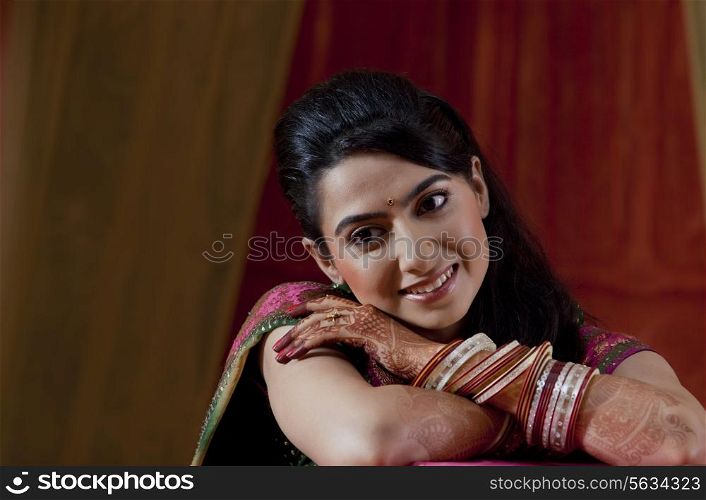 Close-up of happy beautiful young Indian bride