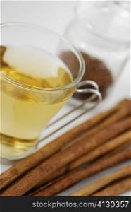 Close-up of herbal tea with breadsticks