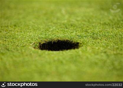 Close-up of hole on putting green