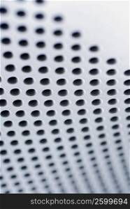 Close-up of holes on a metal surface