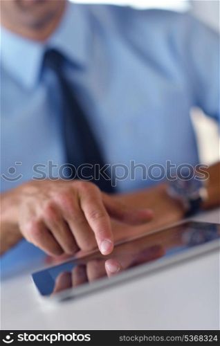close-up of human hand business man using tablet compuer at office