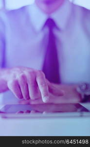 close-up of human hand business man using tablet compuer at office