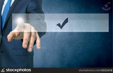 Close up of human hand pushing application icon. Putting tick
