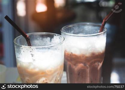 Close up of iced coffee and iced chocolate in glasses