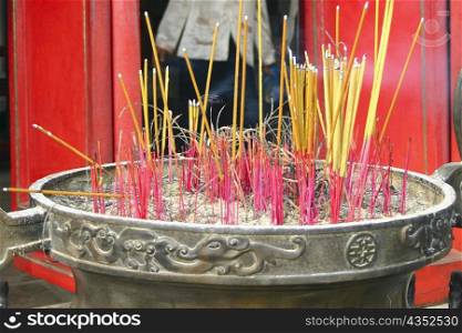 Close-up of incense sticks burning, Hanoi, Vietnam