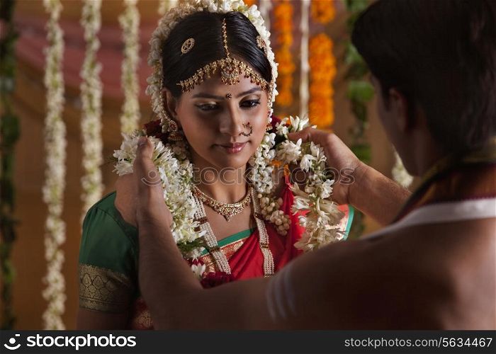 Close-up of Indian couple during wedding ceremony