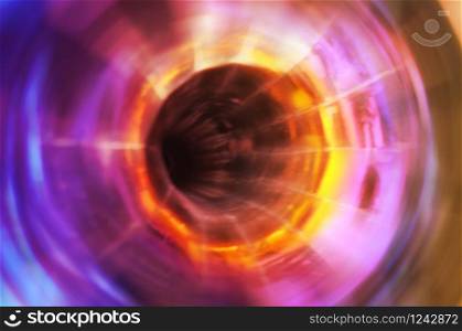 Close-up of inside of the horn of an old gramophone. Abstract image of an old, metallic musical object. Radial blur effect