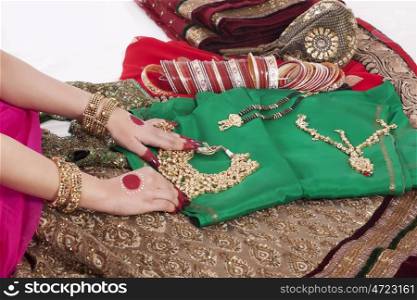 Close-up of jewelry , jewellery , bangles and wedding attire
