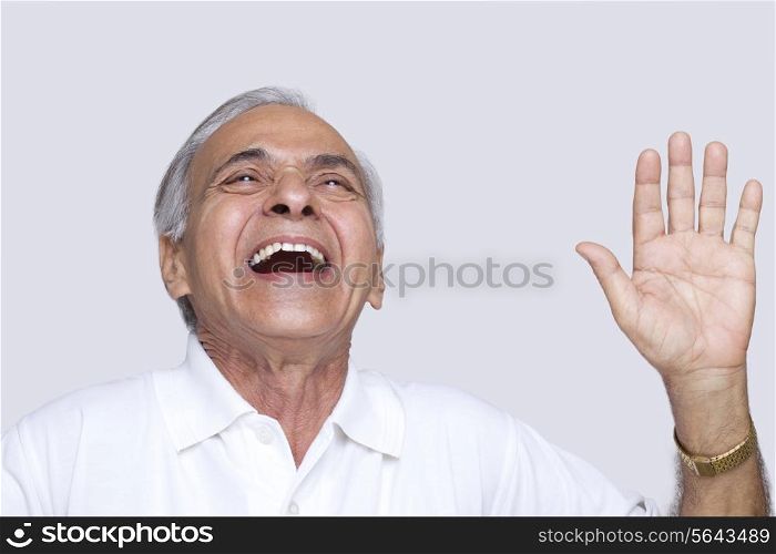 Close-up of joyful senior man over white background