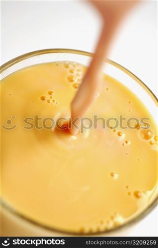 Close-up of juice being poured into a glass