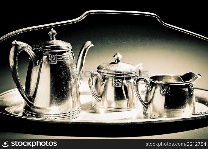 Close-up of kettles on a tray