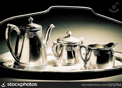 Close-up of kettles on a tray