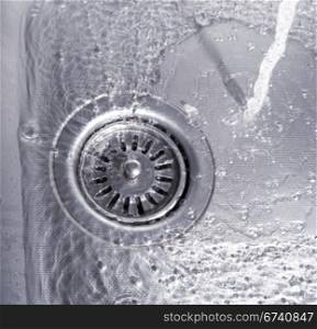 Close-up of kitchen sink with water drops