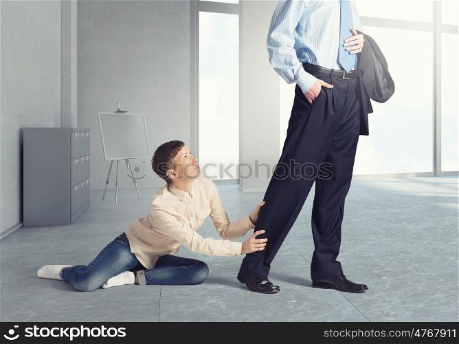 Close up of legs of husband going away and his wife praying him to stay