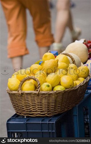 Close-up of lemons in a wicker basket at a market stall, Italian Riviera, Cinque Terre National Park, Vernazza, La Spezia, Liguria, Italy