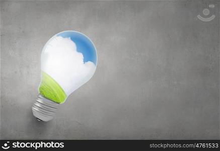 Close up of light bulb and ecology concept in it