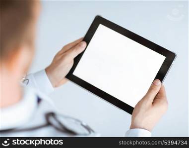 close up of male doctor hands holding tablet pc