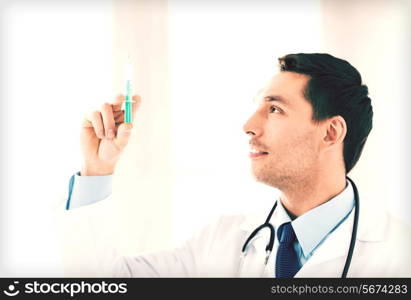 close up of male doctor holding syringe with injection