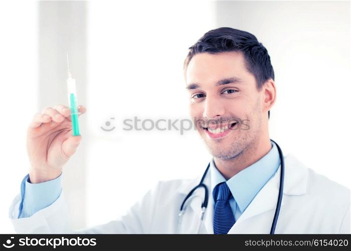close up of male doctor holding syringe with injection. male doctor holding syringe with injection