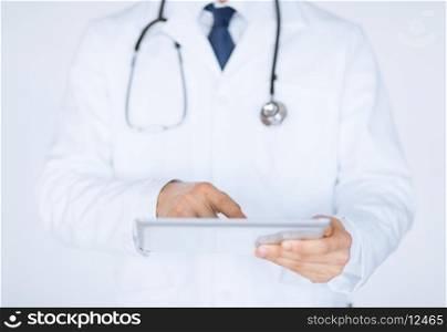 close up of male doctor holding tablet pc
