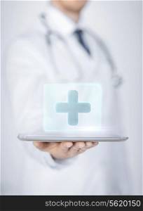 close up of male doctor holding tablet pc with medical app