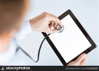 close up of male doctor with stethoscope and tablet pc