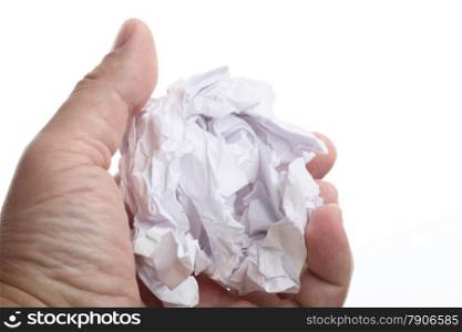 Close up of male hand holding crumpled paper isolated over a white