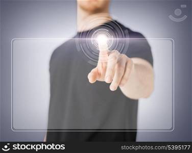 close up of male hand touching virtual screen