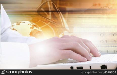 Close up of male hands typing on laptop keyboard. Man using laptop