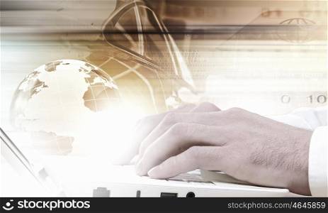 Close up of male hands typing on laptop keyboard. Man using laptop