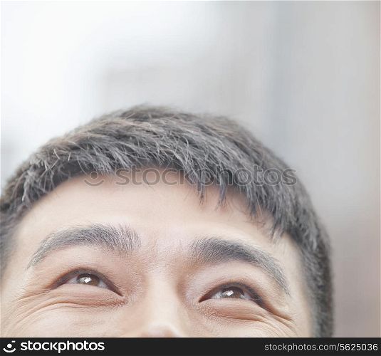 Close Up of Male Looking Up and Smiling in Beijing