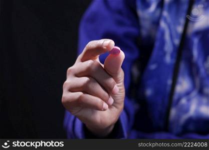 Close up of man hand holding pills in dark .. Close up of man hand holding pills in dark 