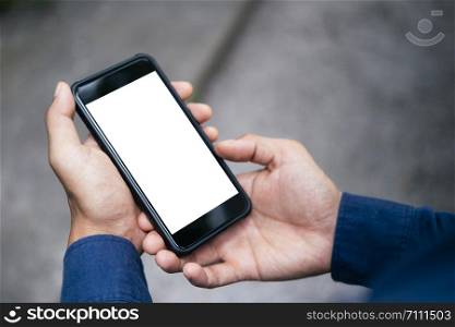 Close up of man hand holding smart phone. Blank screen mockup for graphics display montage.