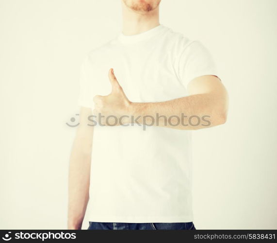 close up of man hand showing thumbs up