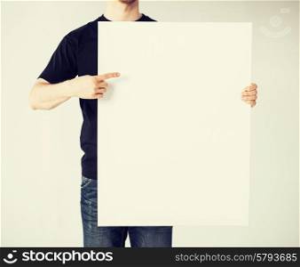 close up of man hands showing white blank board